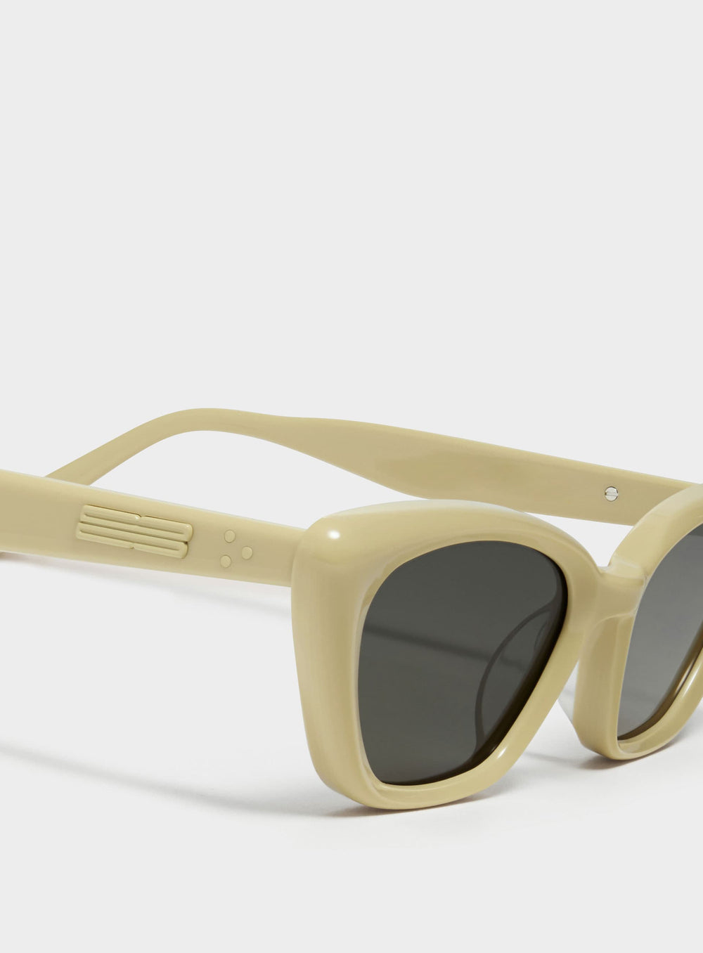 Close-up of California in mayo yellow cat-eye Sunglasses lenses, high-quality eyewear by Mercury Retrograde Burr Puzzle Collection 