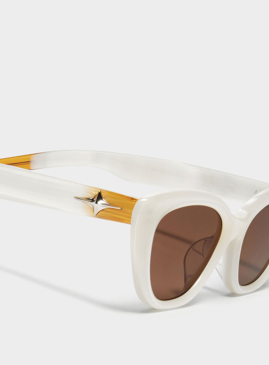 Close-up of Virgo in white cat-eye Sunglasses lenses, high-quality eyewear by Mercury Retrograde Galaxy Collection 
