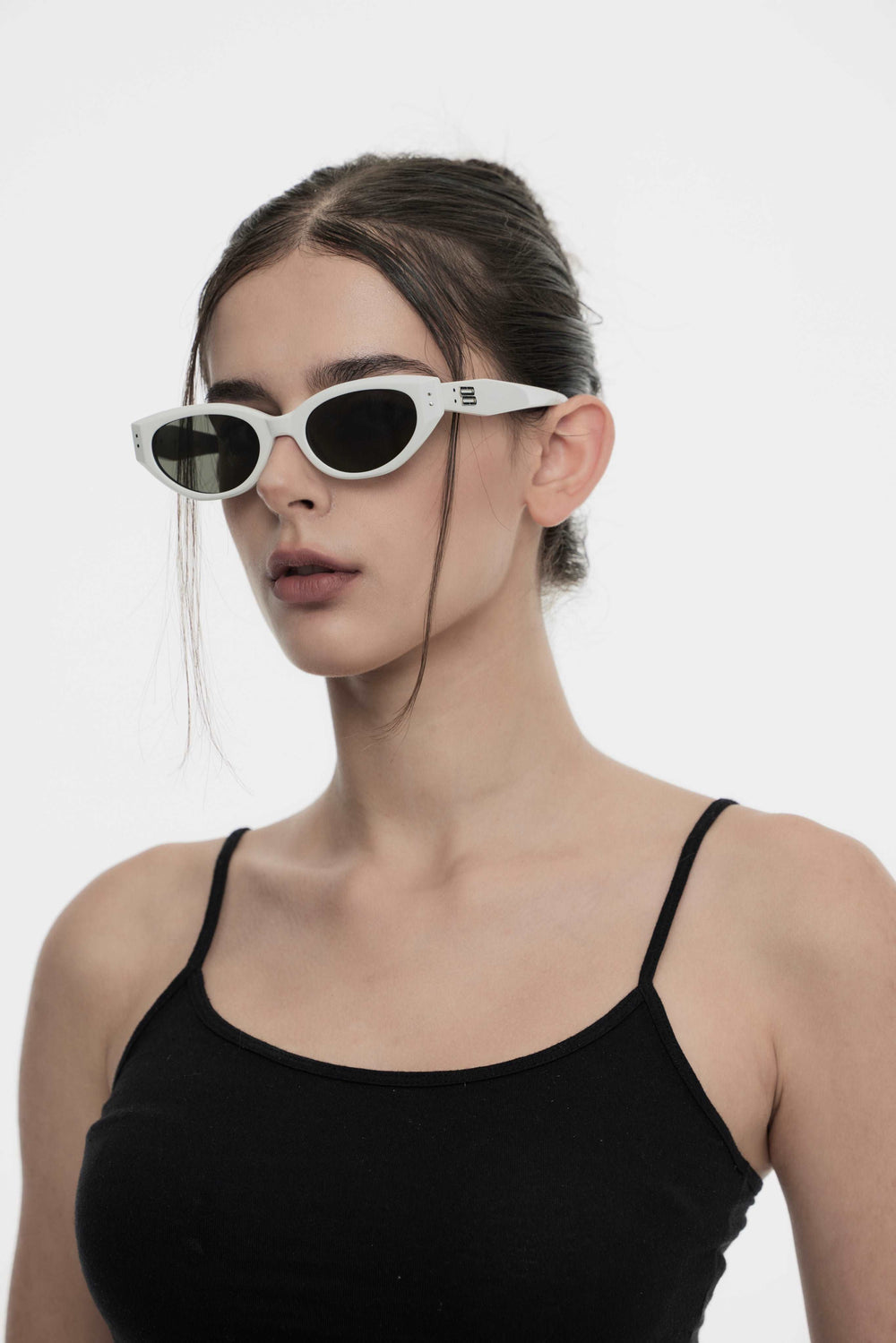 Model wearing Symphony in white cat-eye Designer Sunglasses from Mercury Retrograde Burr Puzzle Collection 