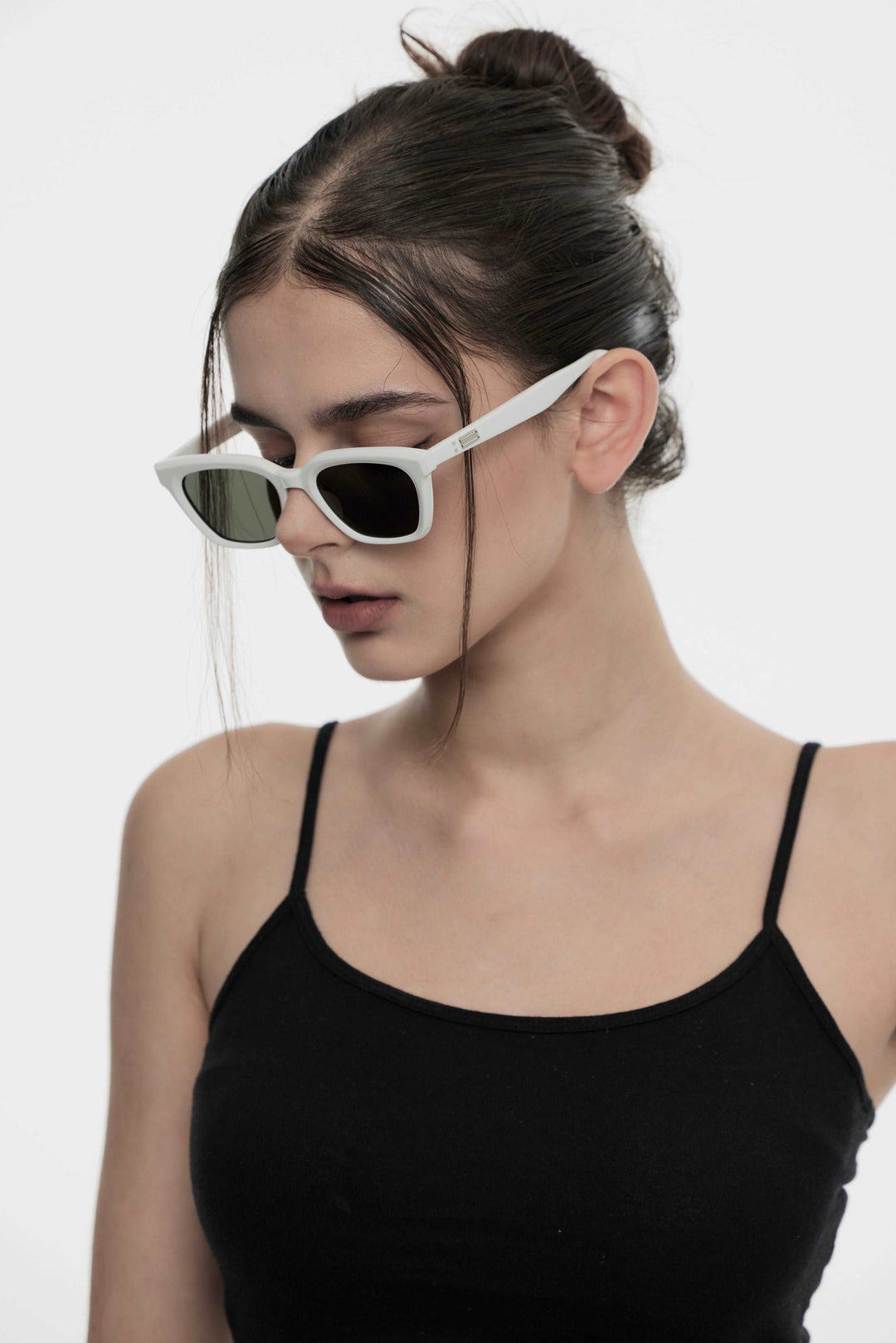 Model of her side face looking down wearing Shadow in white square Kpop Sunglasses from Mercury Retrograde