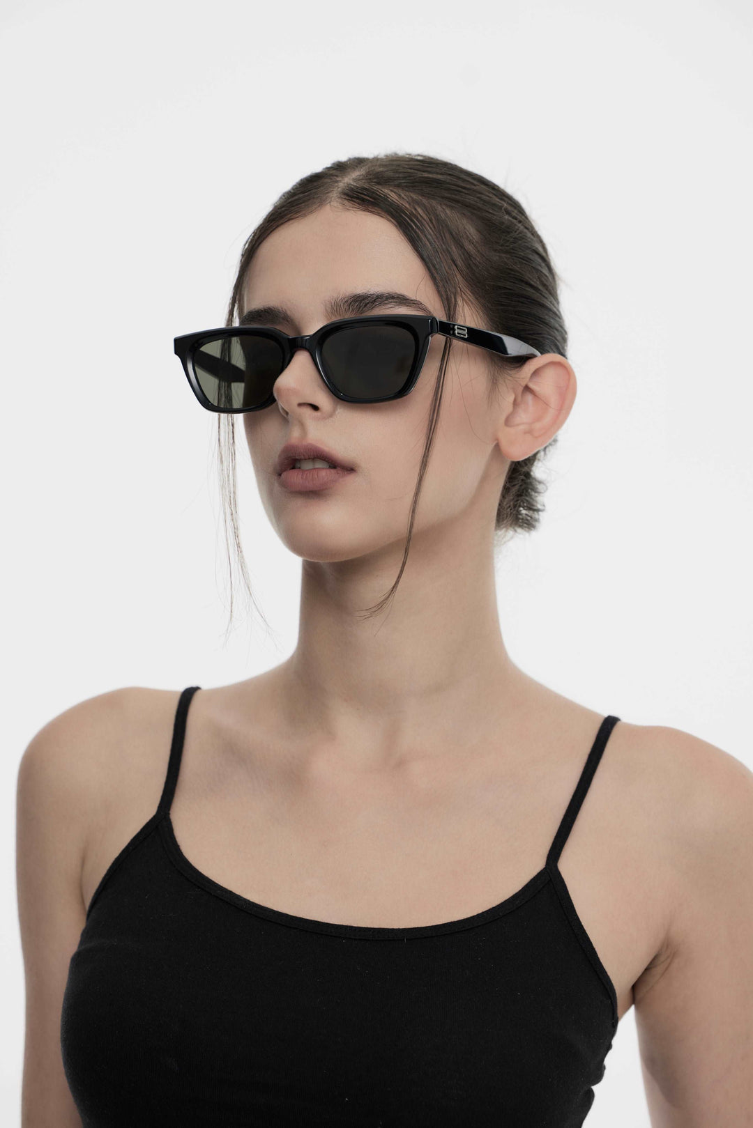 Side profile of model wearing trendy Shadow in black square Sunglasses from Mercury Retrograde Burr Puzzle Collection 
