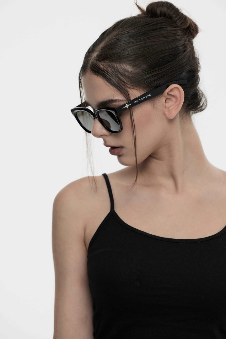 Model of her side face looking down wearing Artist Kpop Cygnus in black square Sunglasses from Mercury Retrograde Galaxy Collection 