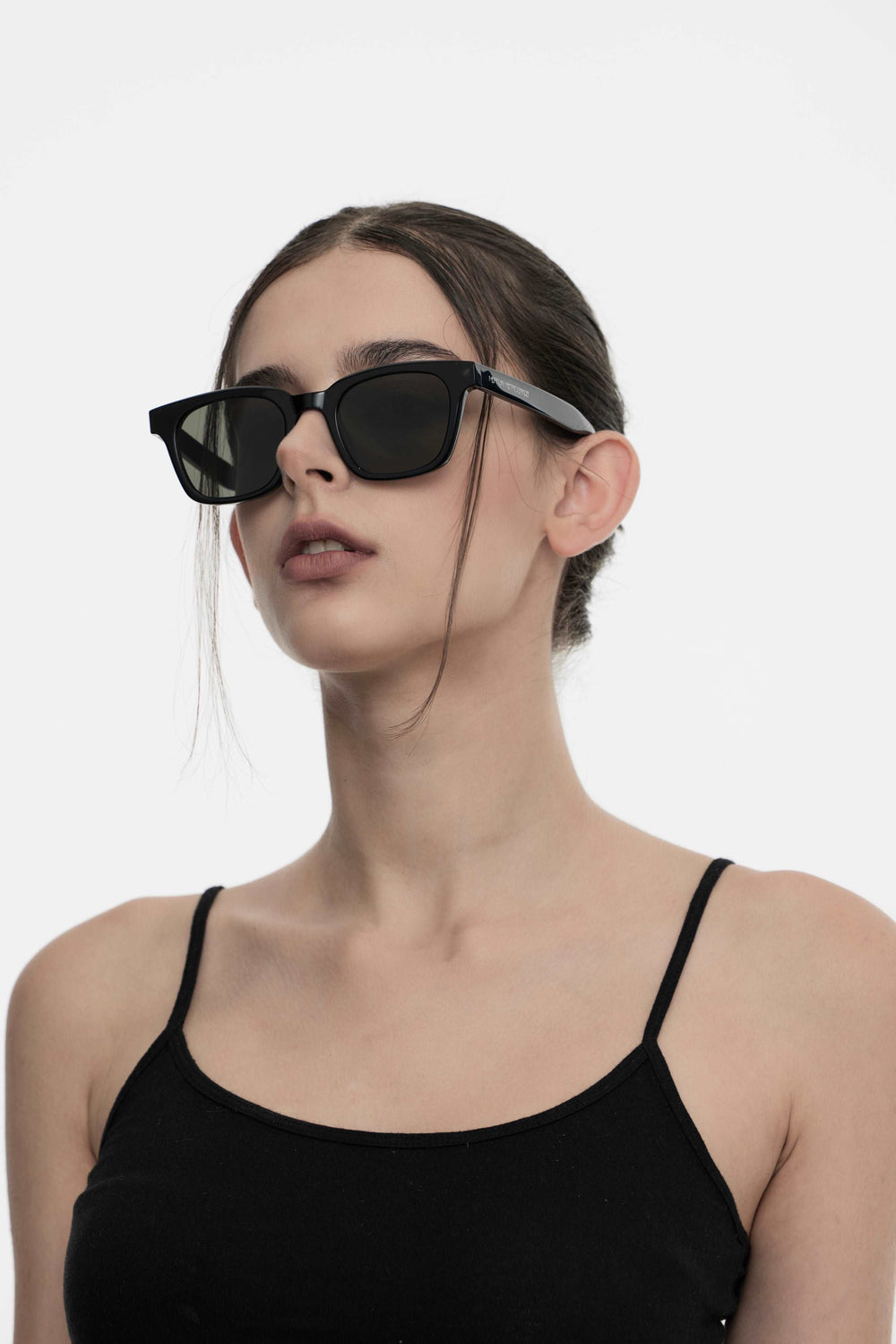 Model of her side face looking up wearing Bubblegum in black square Kpop Sunglasses from Mercury Retrograde Daydream Collection 