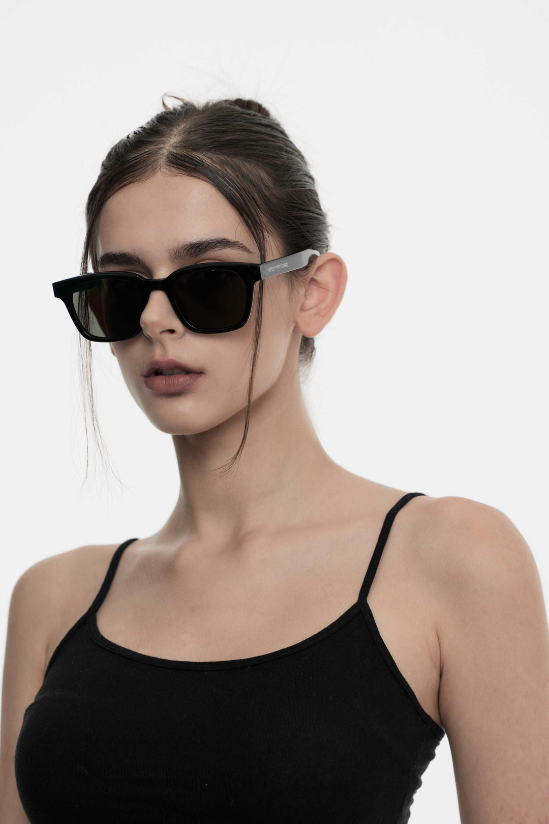 Model showcasing side view of Lust Korean Fashion Bubblegum in black square Sunglasses from Mercury Retrograde's Daydream Collection