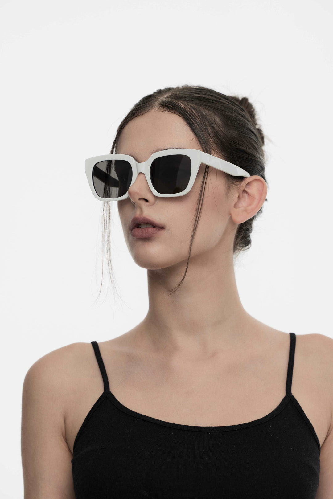 Model of her side face looking up wearing Muse in pink square K-pop Sunglasses from Mercury Retrograde Daydream Collection 