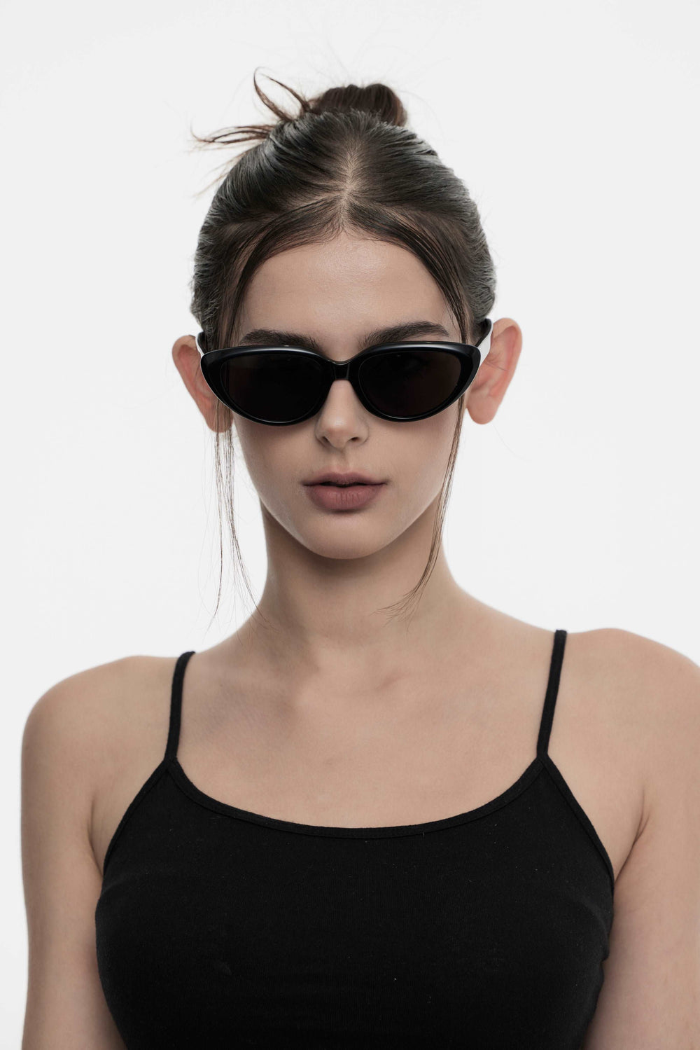Female Model of her front face wearing Daydream’s BEBE black sunglasses for fashionistas from Mercury Retrograde