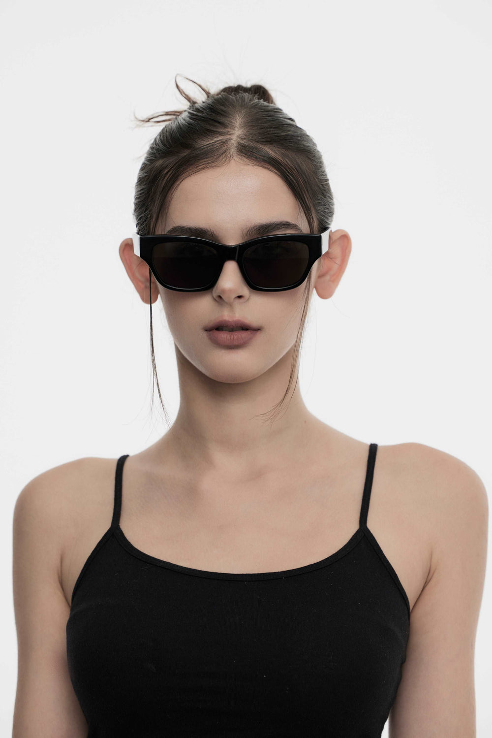 Female Model of her front face wearing Daydream’s Muse in black square trendy sunglasses from Mercury Retrograde 