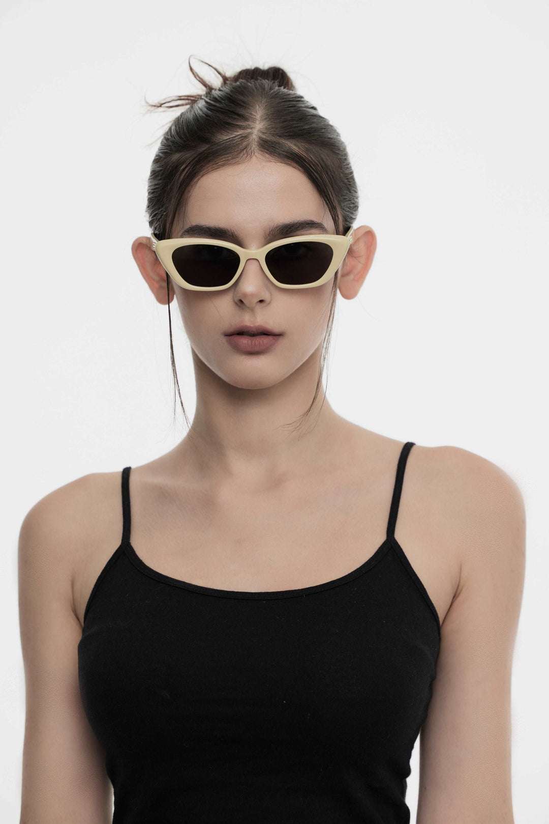 Female Model of her front face wearing California in mayo yellow cat-eye stylish sunglasses from Mercury Retrograde Burr Puzzle Collection 