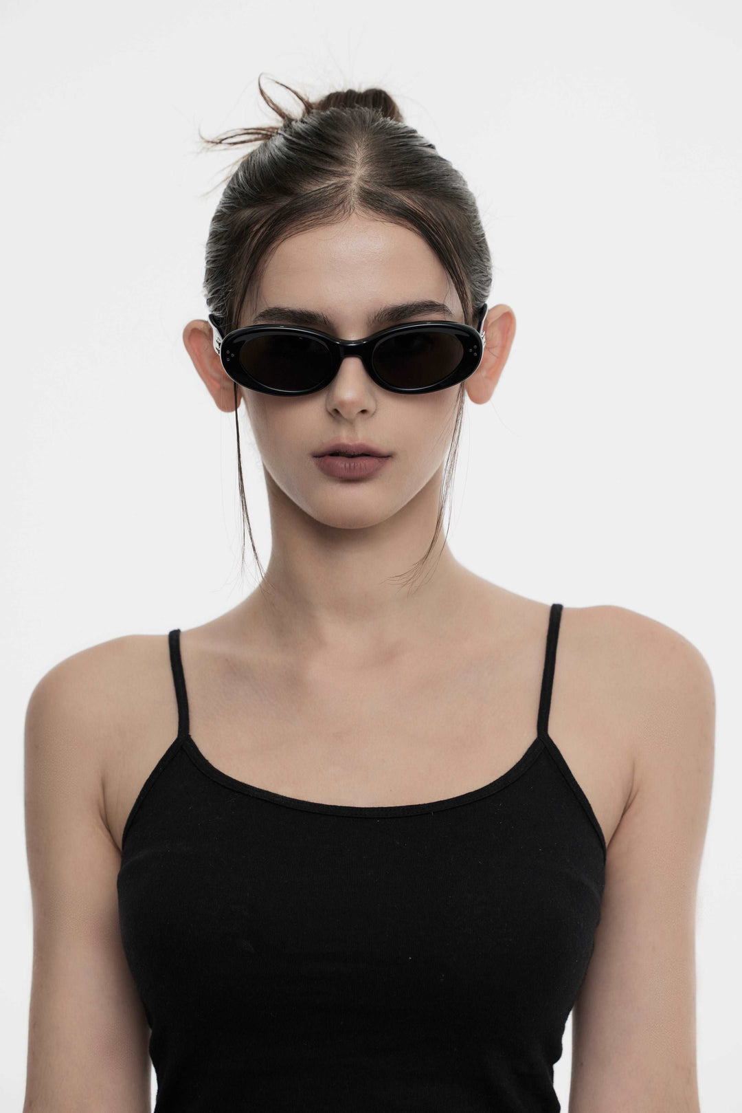 Female Model of her front face wearing Breath in black High-quality round sunglasses from Mercury Retrograde Burr Puzzle Collection 