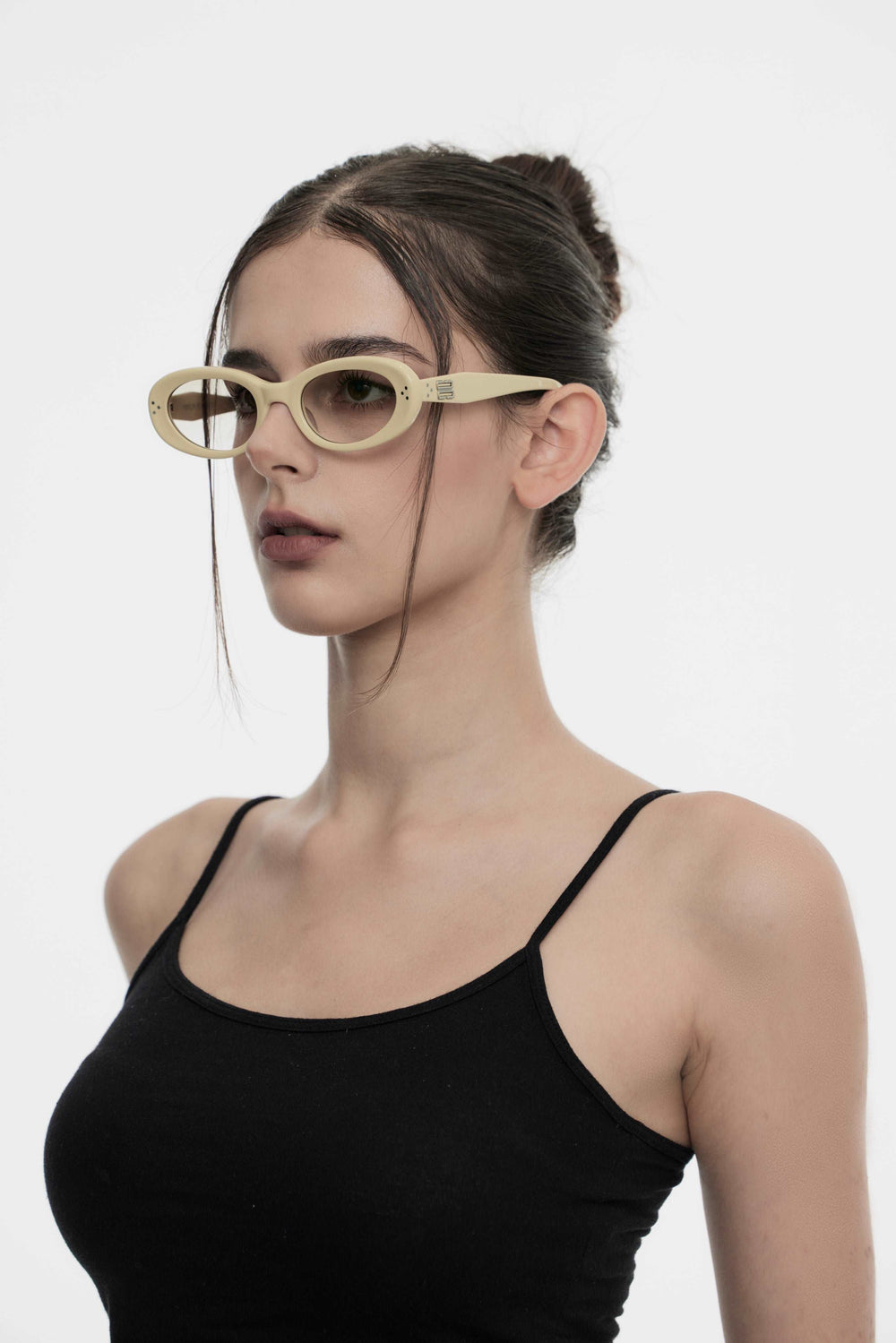 Side profile of model wearing trendy Burr Puzzle’s Breath in light yellow round Sunglasses with UV protection from Mercury Retrograde