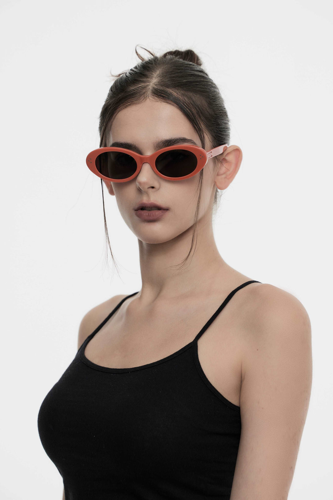 Model wearing Wave in red round Designer Sunglasses for fashionistas from Mercury Retrograde Burr Puzzle Collection 