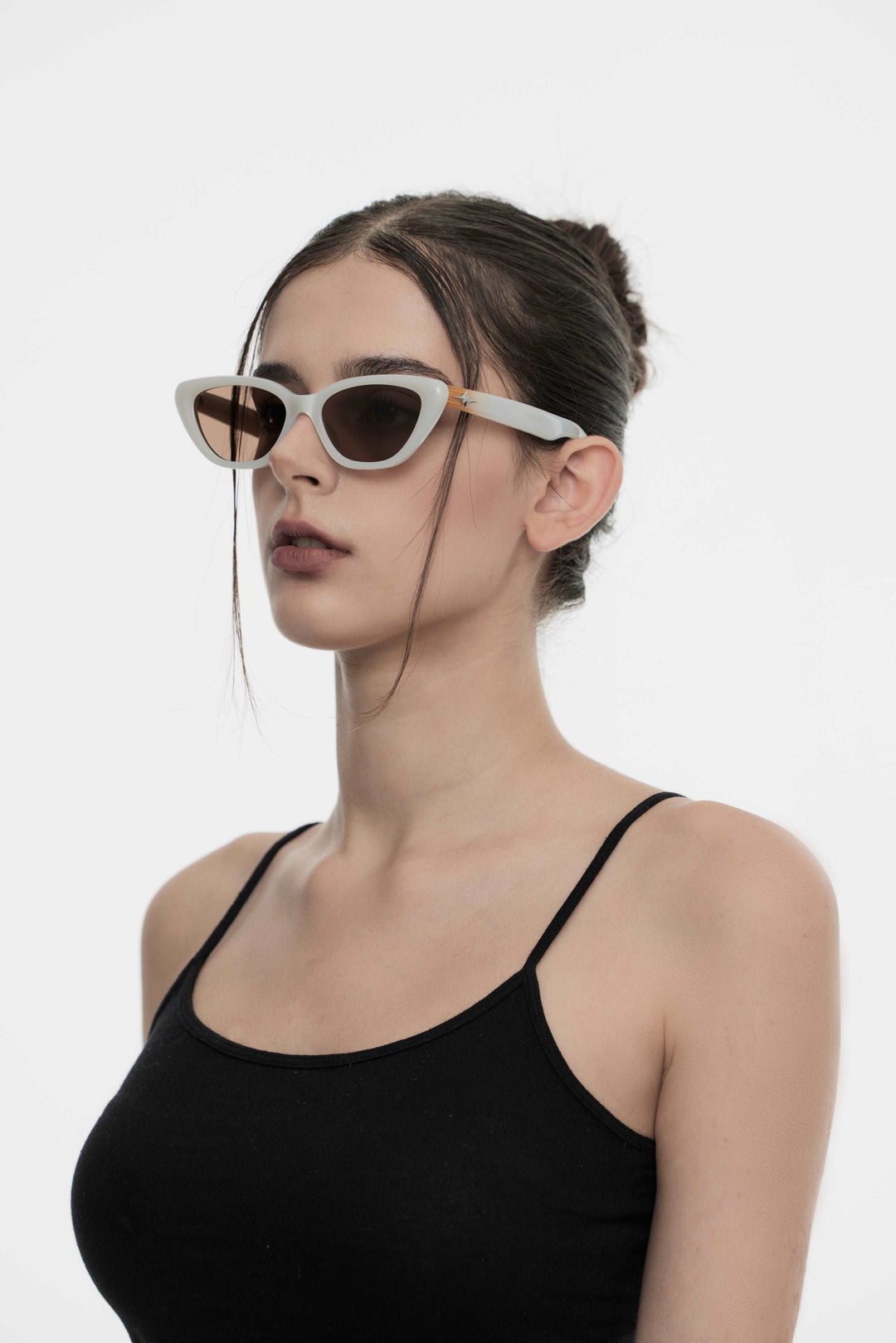 Model showcasing side view of Lust Korean Fashion Virgo in white cat-eye Sunglasses from Mercury Retrograde's Galaxy Collection
