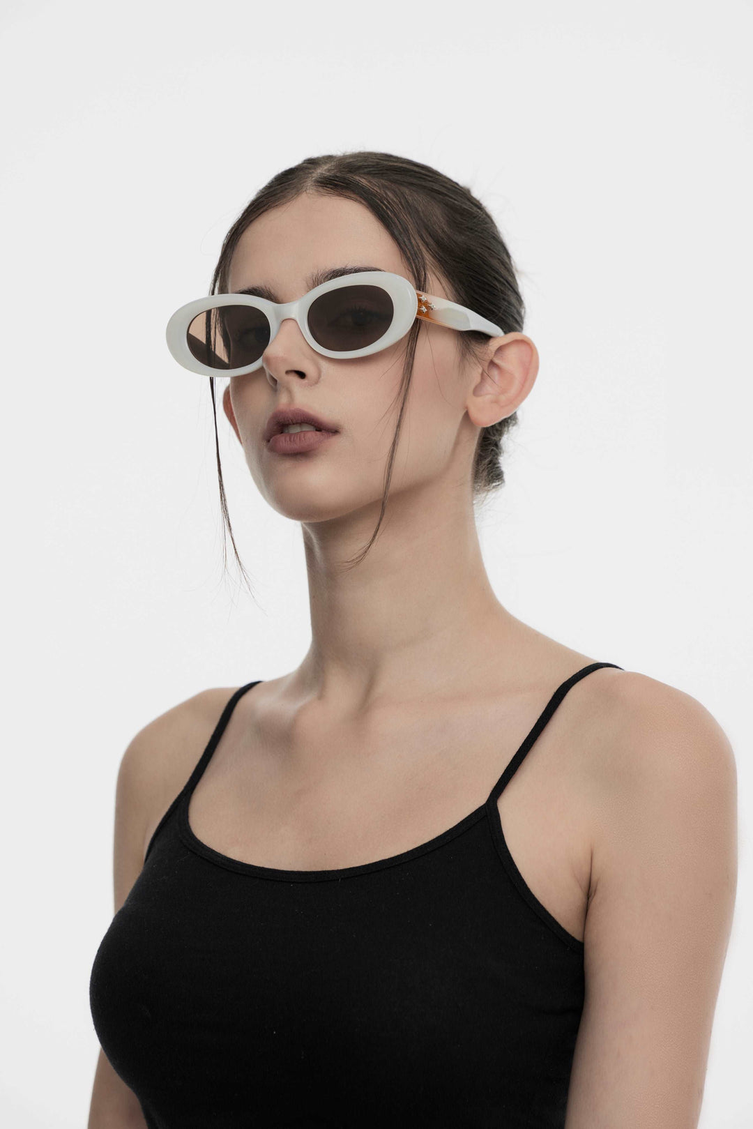 Side profile of model wearing trendy Triangulum in white round Sunglasses from Mercury Retrograde Galaxy Collection 