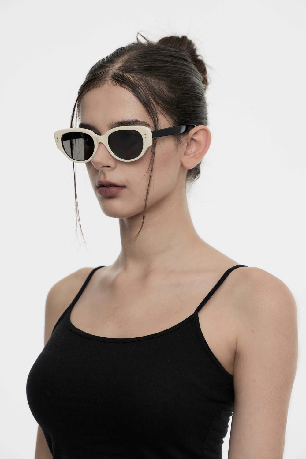 Model showcasing side view of Lust Korean Fashion Panda in black&white round Sunglasses from Mercury Retrograde's Daydream Collection