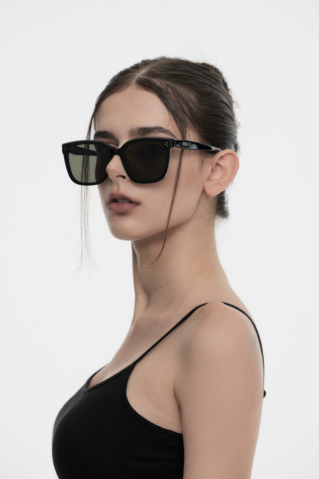 Model wearing Indulge in black square Designer Sunglasses from Mercury Retrograde Burr Puzzle Collection 