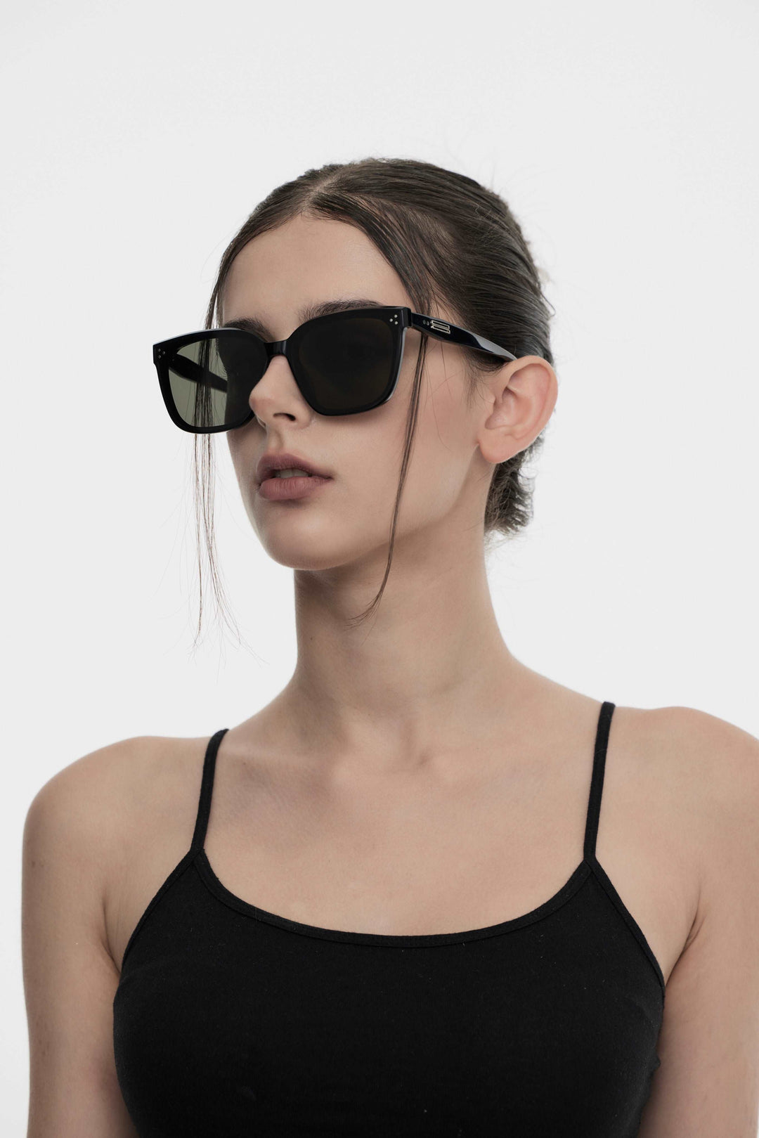 Model of her side face looking up wearing Indulge in black  Korean Fashion square Sunglasses from Mercury Retrograde Burr Puzzle Collection 