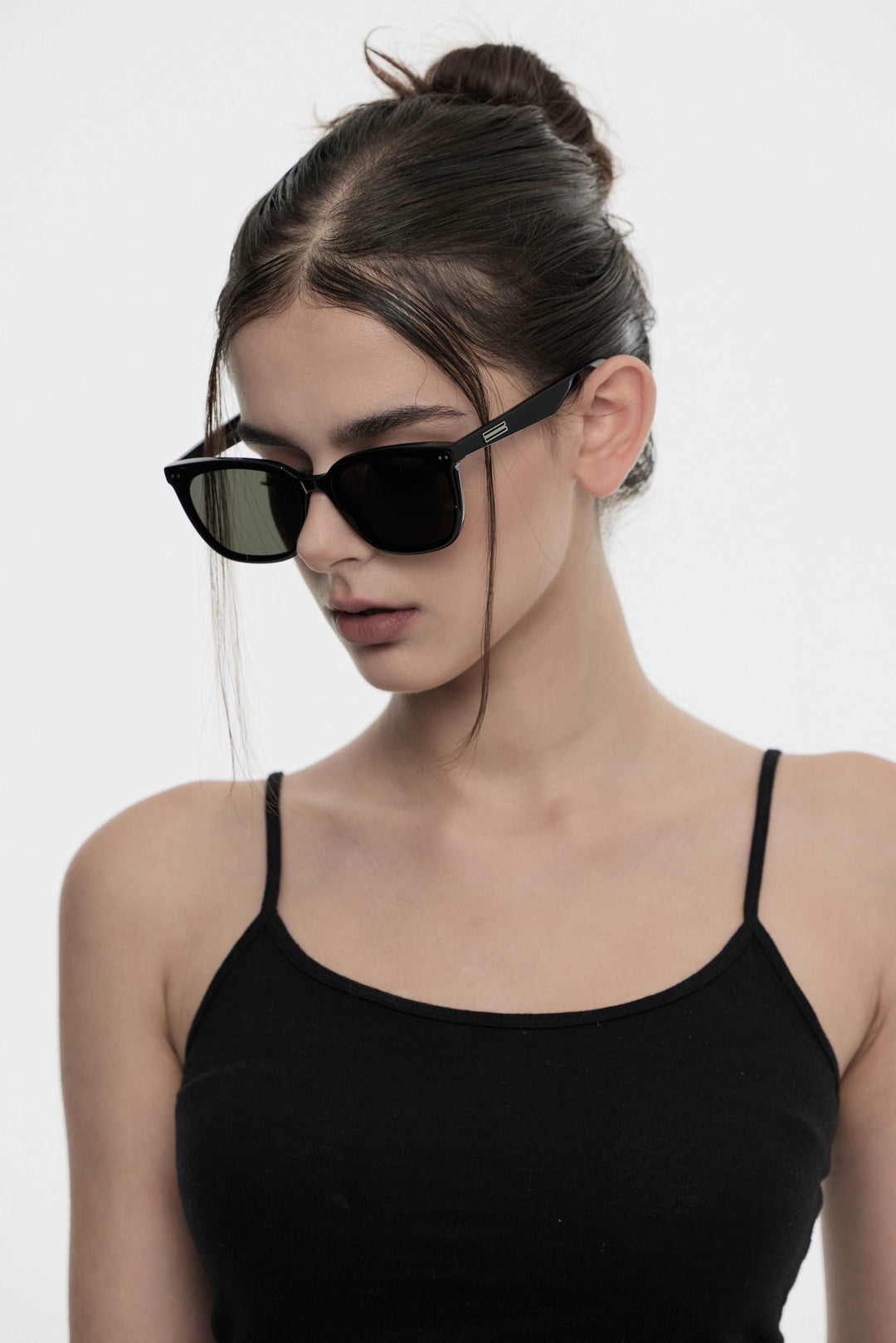 Model of her side face looking down wearing Artist Korean Fashion Sunglasses from Mercury Retrograde