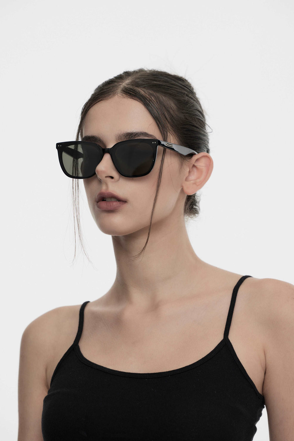 Model of her side face looking down wearing Artist Kpop Sunglasses from Mercury Retrograde