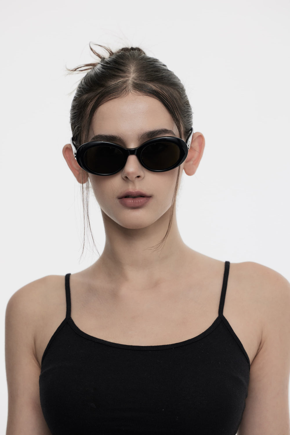 Female Model of her front face wearing Burr Puzzle Collection’s Poison in black round stylish sunglasses from Mercury Retrograde