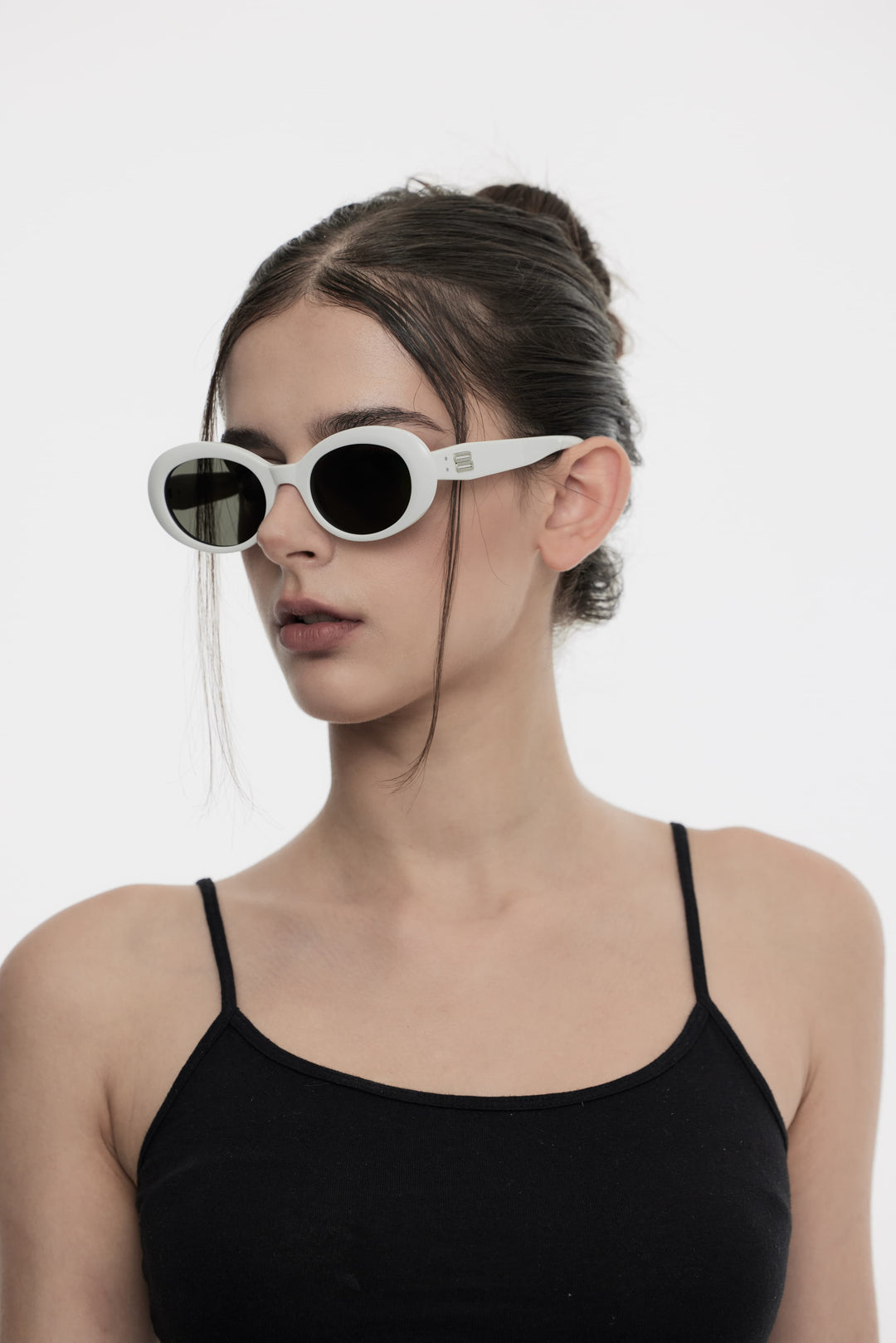 Side portrait of model illustrating the trendy design of Burr Puzzle's Poison in white round Sunglasses by Mercury Retrograde