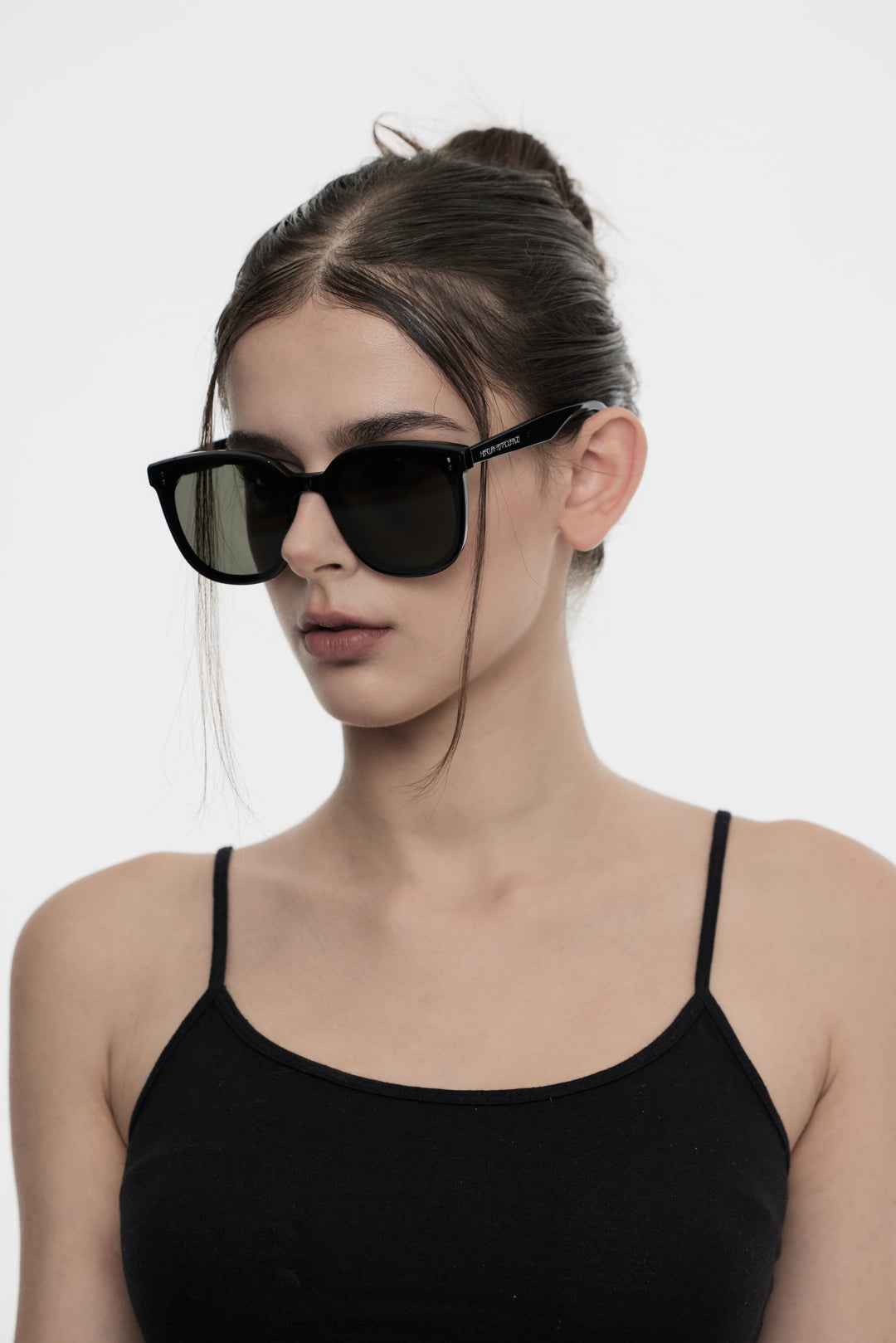 Model wearing Manta in black square Designer Sunglasses with UV protection from Mercury Retrograde Burr Puzzle Collection 