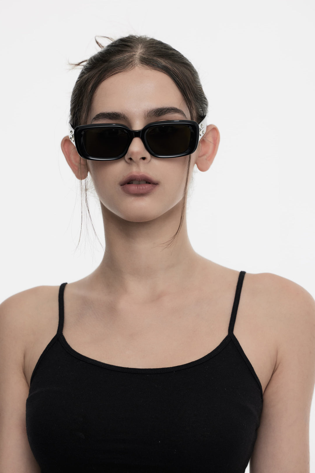 Female Model of her front face wearing Galaxy’s Sextans in black square  sunglasses with UV protection from Mercury Retrograde 
