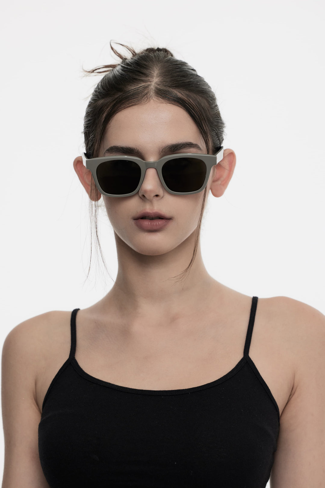 Female Model of her front face wearing Bubblegum in grey High-quality square sunglasses from Mercury Retrograde Daydream Collection 