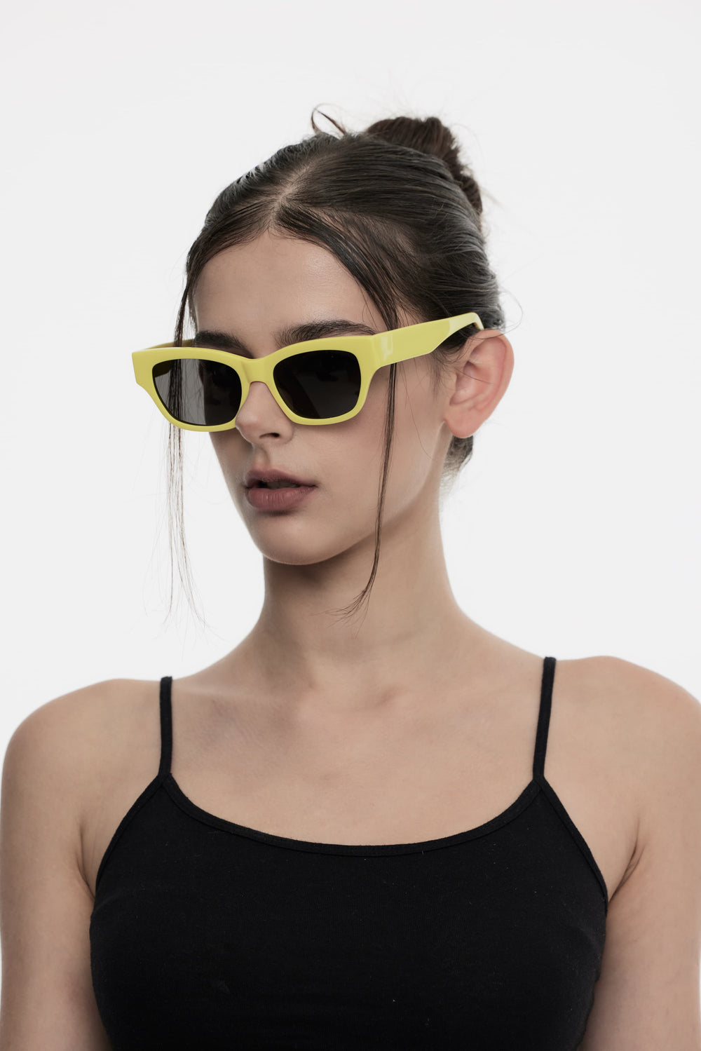 Side portrait of model illustrating the trendy design of Daydream's Muse in pink square Sunglasses by Mercury Retrograde
