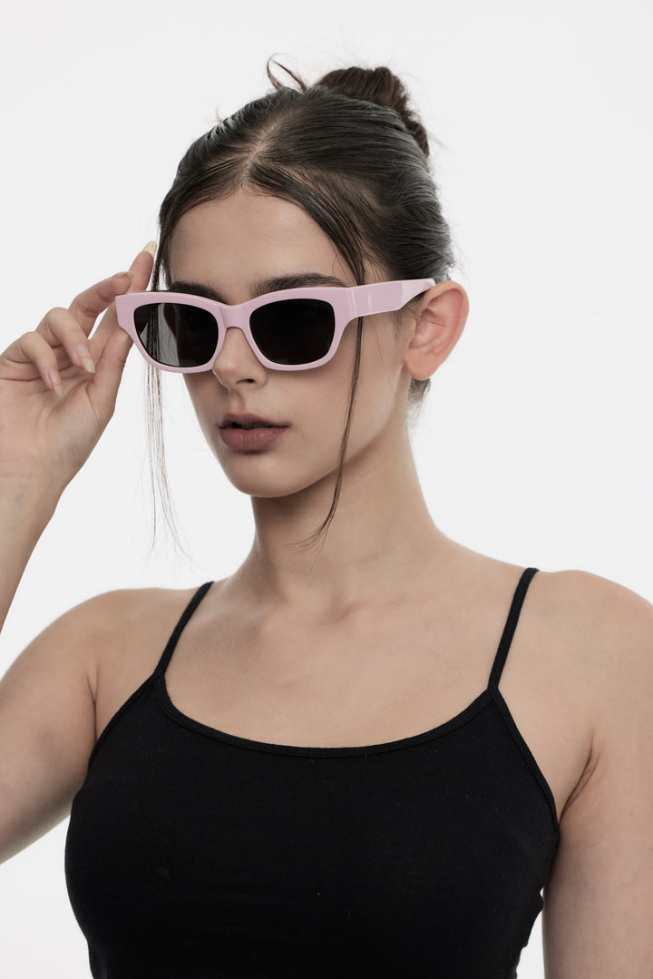 Side portrait of model illustrating the stylish design of Daydream's Muse in pink square Sunglasses by Mercury Retrograde