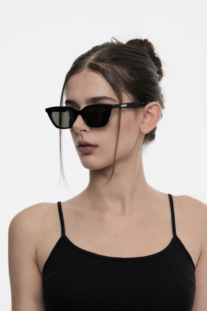 Model wearing Lust in black cat-eye Designer Sunglasses from Mercury Retrograde Burr Puzzle Collection 