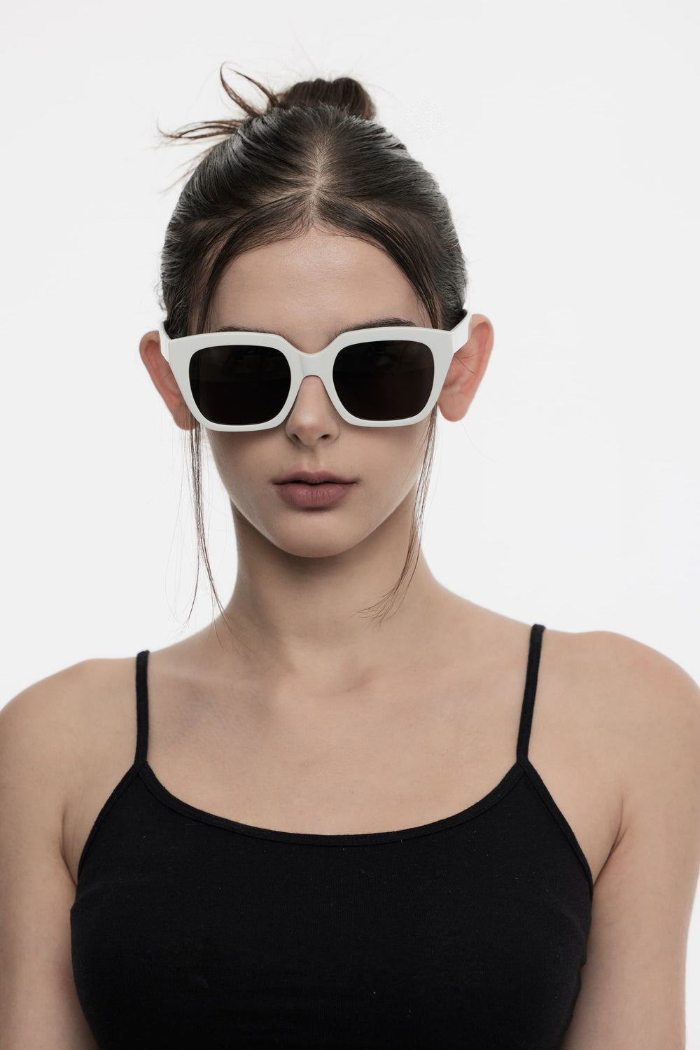Female Model of her front face wearing Marshmallow in white square High-quality sunglasses from Mercury Retrograde Daydream Collection 