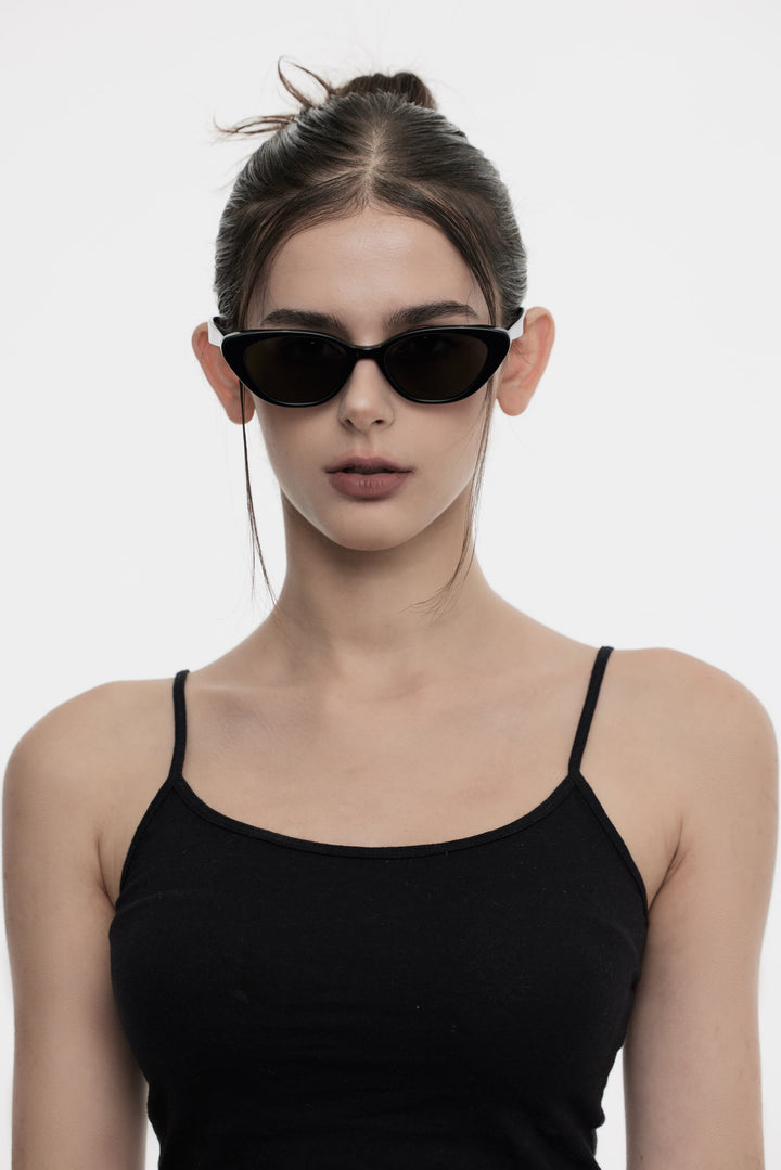 Female Model of her front face wearing Dawn in black cat-eye stylish sunglasses from Mercury Retrograde Daydream Collection 
