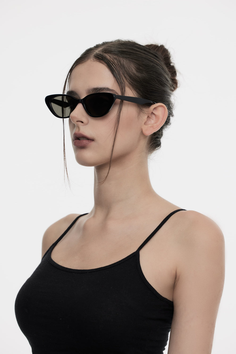 Model showcasing side view of Lust Korean Fashion Dawn in black cat-eye Sunglasses from Mercury Retrograde's Daydream Collection