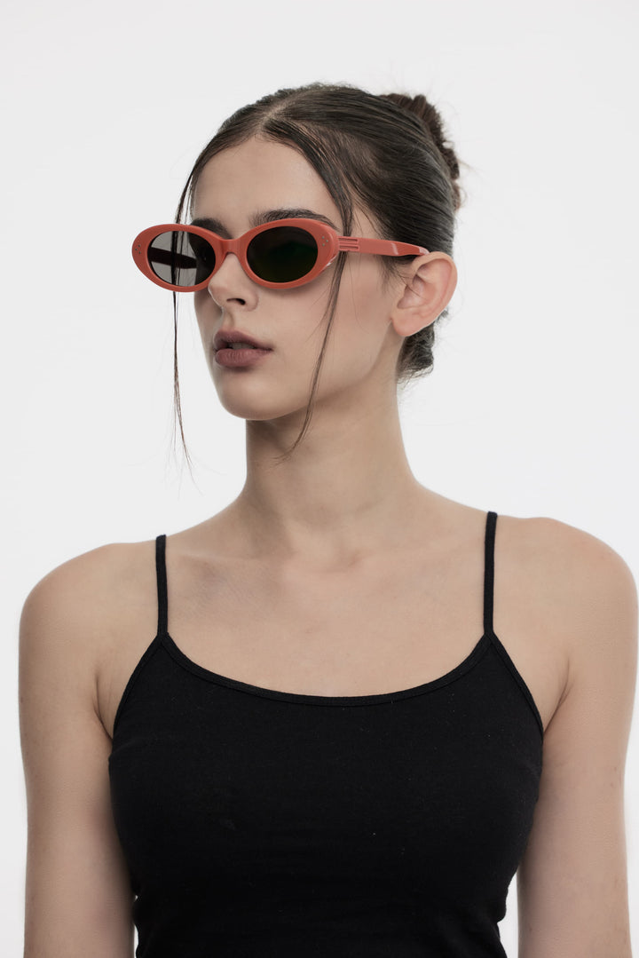 Side profile of model wearing trendy Wave in red round Sunglasses from Mercury Retrograde Burr Puzzle Collection 