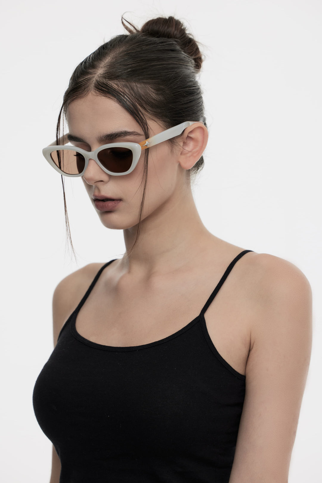 Model of her side face looking down wearing Virgo in white cat-eye Kpop Sunglasses from Mercury Retrograde Galaxy Collection 