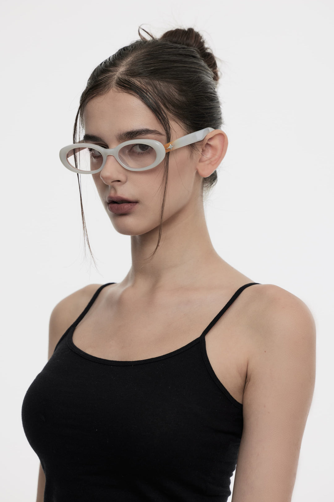 Model showcasing side view of Lust Korean Fashion Crux in white round Sunglasses from Mercury Retrograde's Galaxy Collection