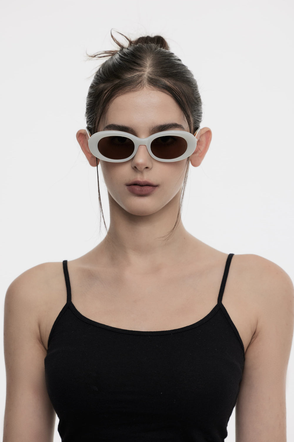 Female Model of her front face wearing Triangulum in white round High-quality sunglasses from Mercury Retrograde Galaxy Collection 