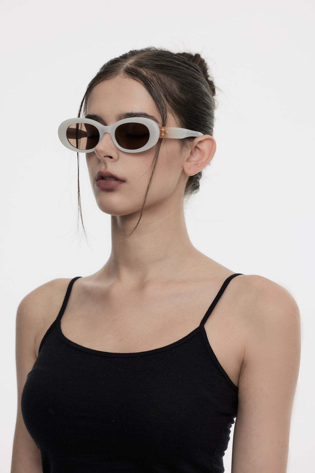 Model showcasing side view of Lust Korean Fashion Triangulum in white round Sunglasses from Mercury Retrograde's Galaxy Collection