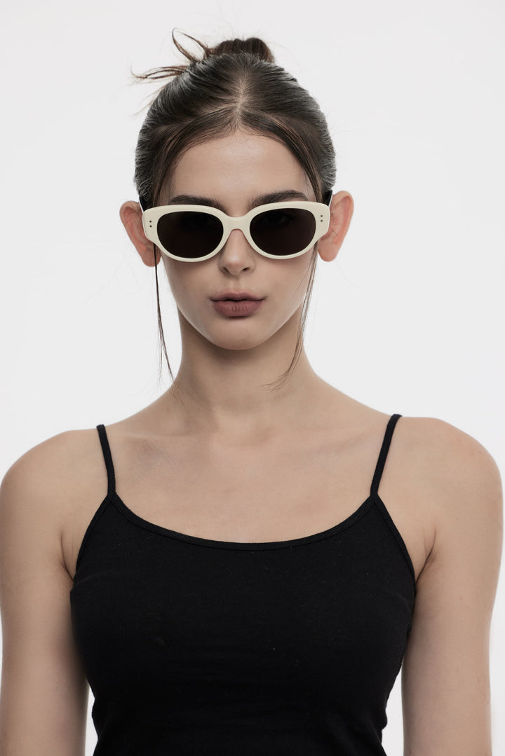 Female Model of her front face wearing Panda in black&white High-quality sunglasses from Mercury Retrograde Daydream Collection 