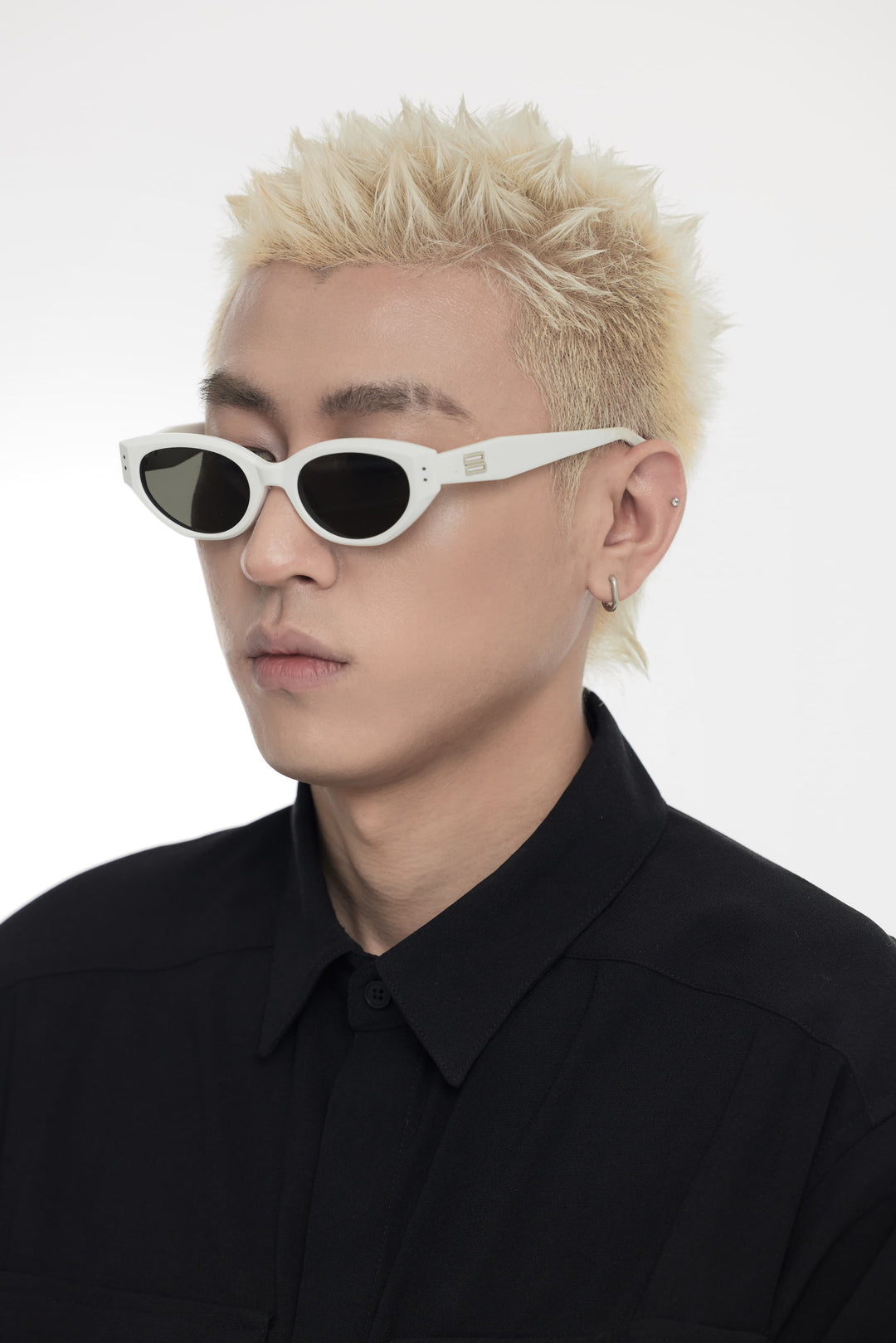 Model showcasing side view of Lust Korean Fashion Symphony in white cat-eye Sunglasses from Mercury Retrograde's Burr Puzzle Collection