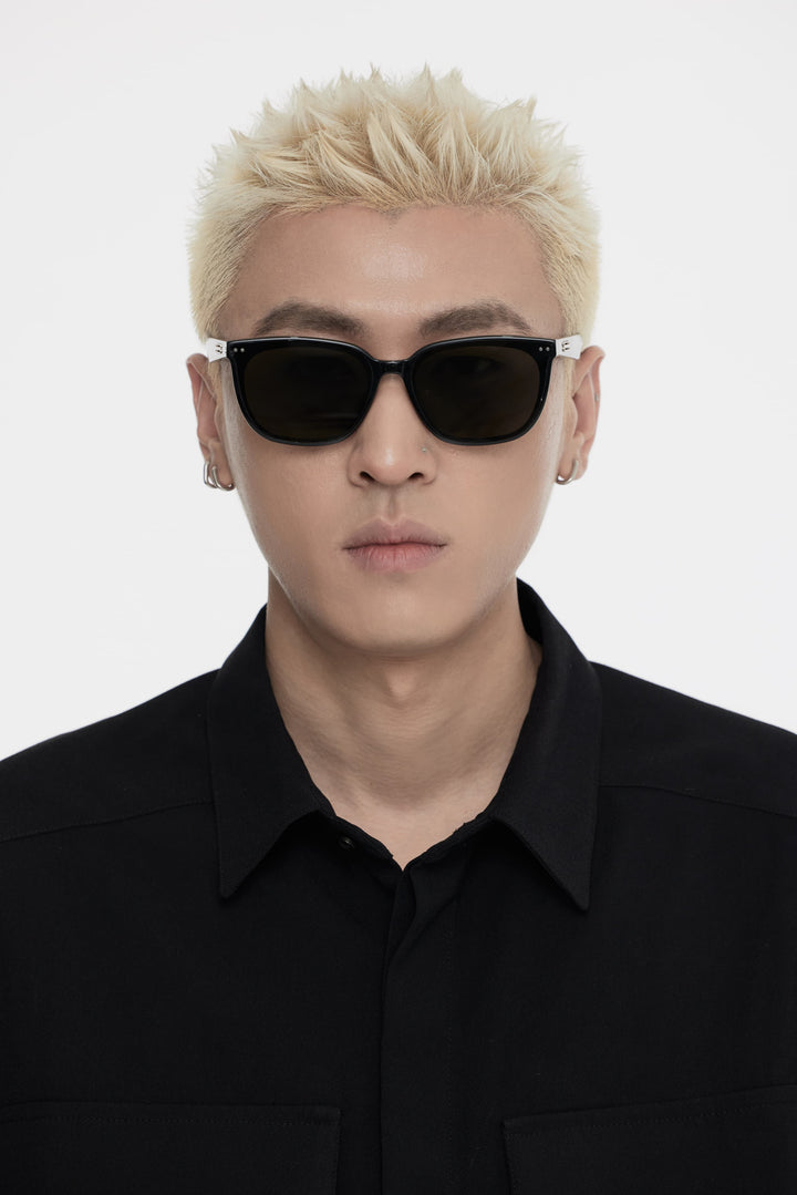 Male Model of his front face wearing Indulge in black trendy square sunglasses from Mercury Retrograde Burr Puzzle Collection 