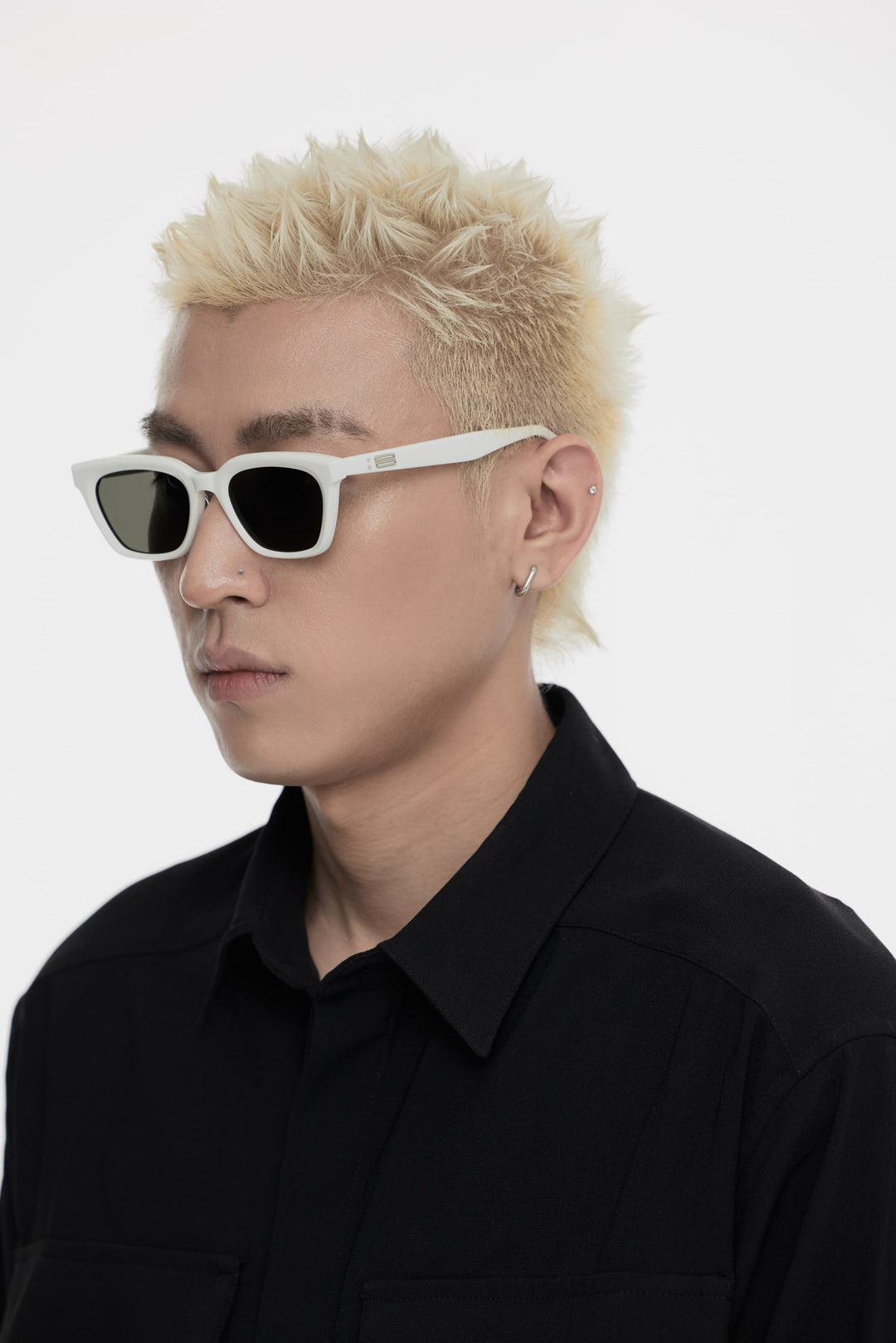 Model showcasing side view of Lust Korean Fashion Shadow in white square Sunglasses from Mercury Retrograde's Burr Puzzle Collection