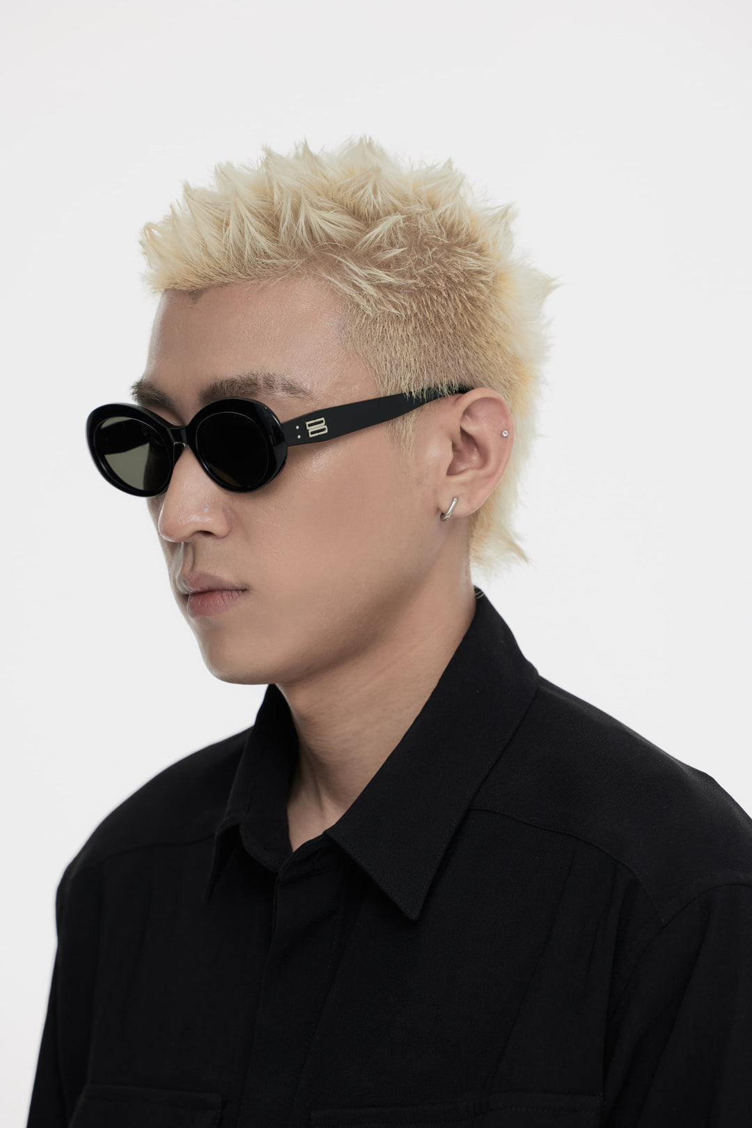 Model showcasing side view of Lust Korean Fashion Poison in black round Sunglasses from Mercury Retrograde's Burr Puzzle Collection