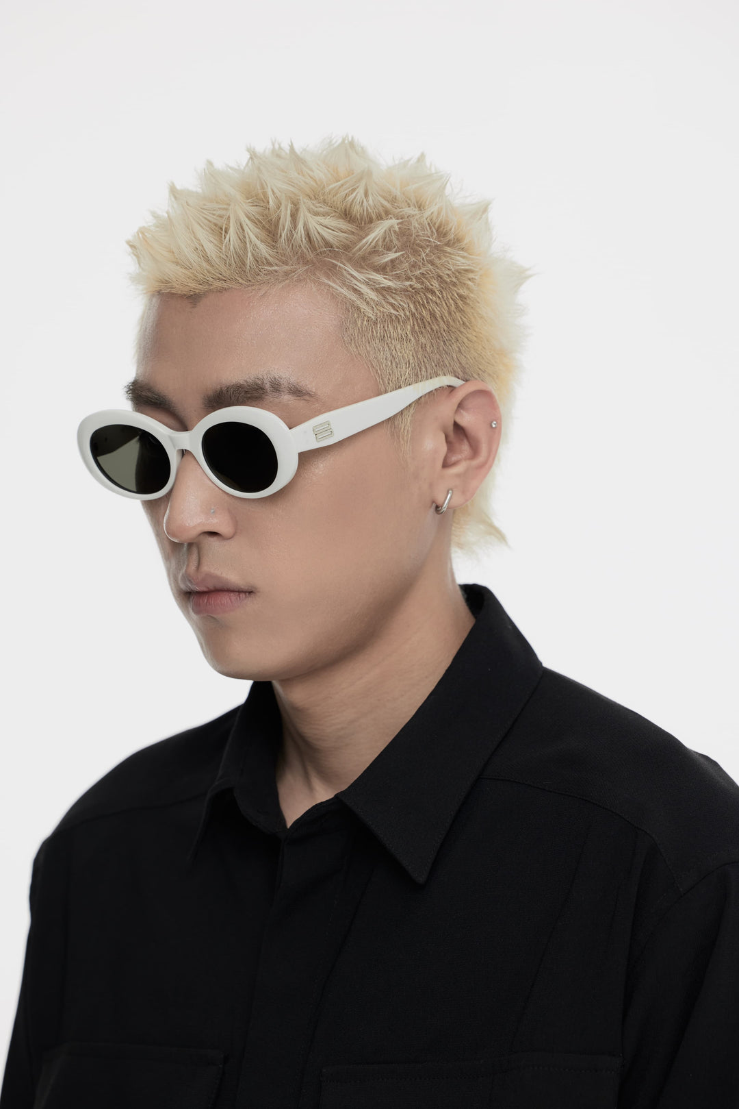 Model showcasing side view of Lust Korean Fashion Poison in white round Sunglasses from Mercury Retrograde's Burr Puzzle Collection