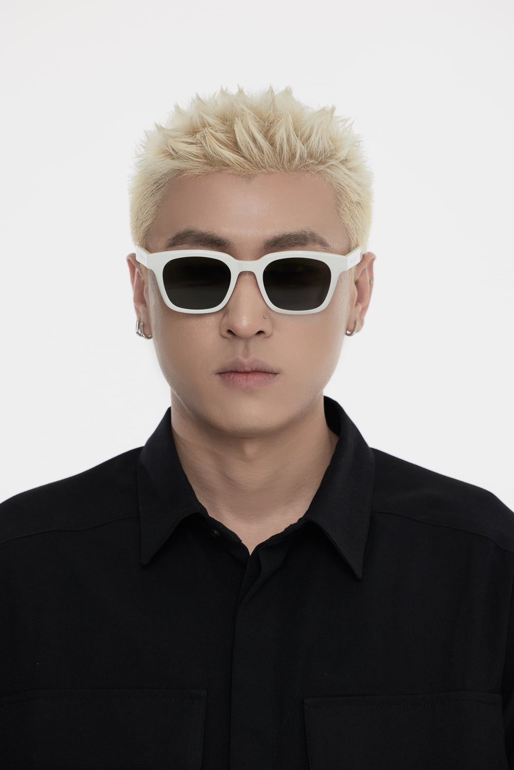 Male Model of his front face wearing Bubblegum in white square trendy sunglasses from Mercury Retrograde Daydream Collection 