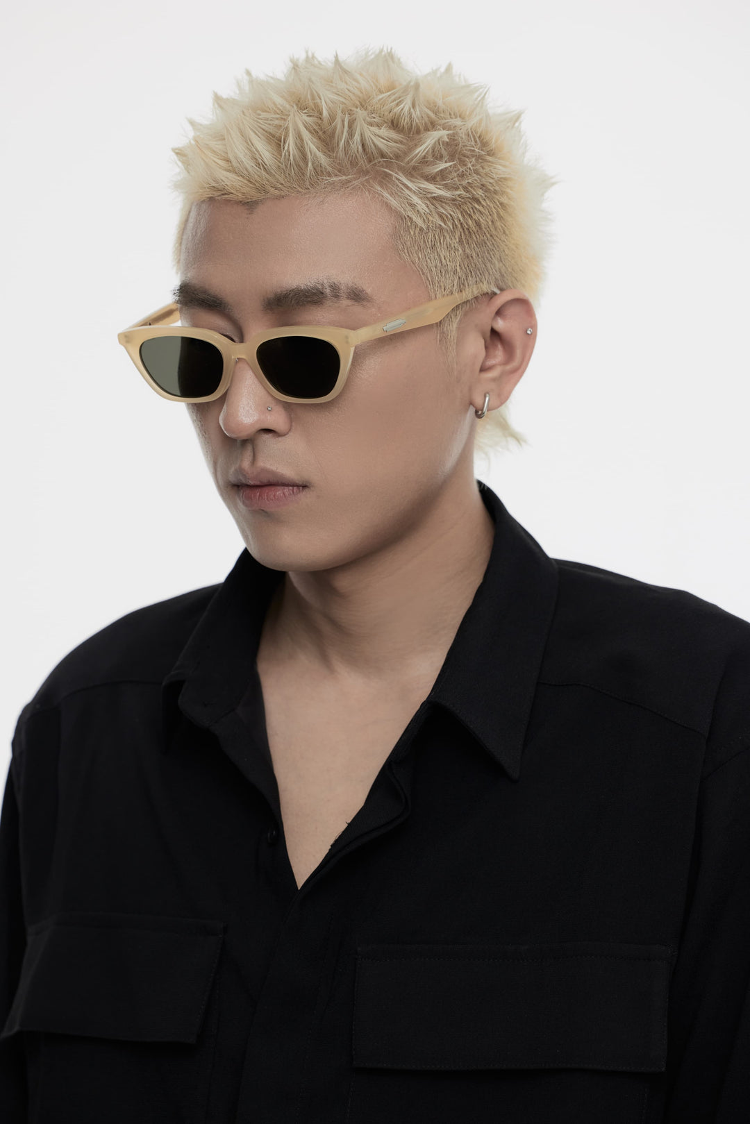 Model of his side face looking down wearing Lust in yellow cat-eye Korean Fashion Sunglasses from Mercury Retrograde Burr Puzzle Collection 