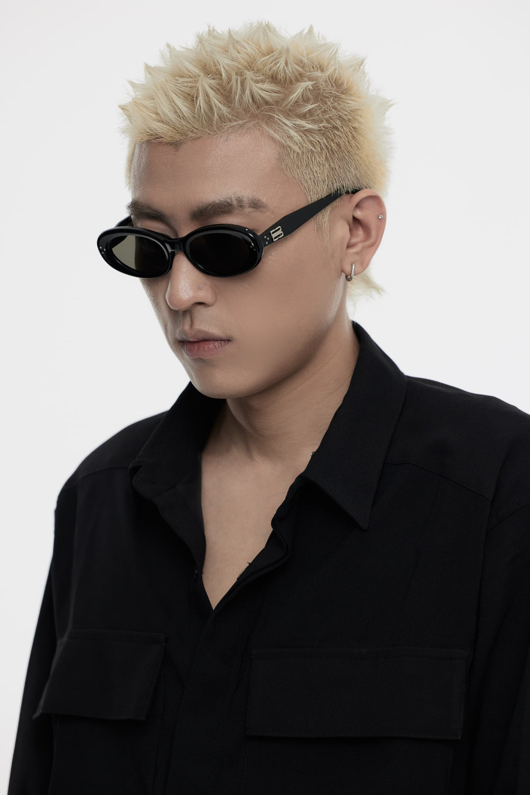 Model of his side face looking down wearing Breath in black Korean Fashion Sunglasses from Mercury Retrograde Burr Puzzle Collection 