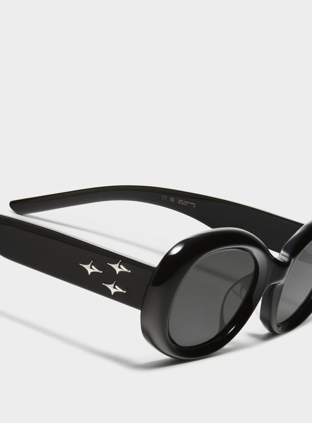 Close-up of Triangulum in black round Sunglasses lenses, high-quality eyewear by Mercury Retrograde Galaxy Collection 