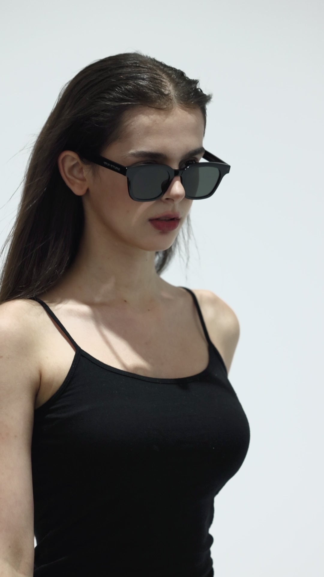 Walking model wearing Bubblegum in black square Designer Sunglasses from Mercury Retrograde Daydream collection 