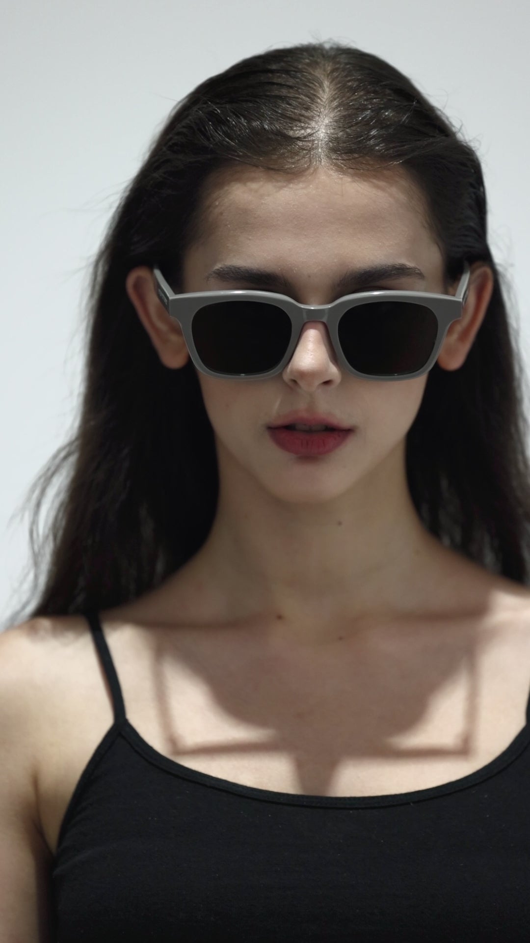 Walking model wearing Bubblegum in grey square Designer Sunglasses from Mercury Retrograde Daydream Collection 